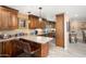 Kitchen features granite countertops, pendant lighting, and wood cabinets at 12826 W Maplewood Dr, Sun City West, AZ 85375