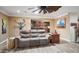 Comfortable living room with wood-look tile floors and an open concept design at 12826 W Maplewood Dr, Sun City West, AZ 85375