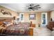 Main bedroom featuring a decorative ceiling fan and plantation shutters at 12826 W Maplewood Dr, Sun City West, AZ 85375