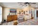 Main bedroom with wood floors, dresser and sitting chair near window at 12826 W Maplewood Dr, Sun City West, AZ 85375