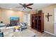 Office featuring hardwood floors, a ceiling fan, a large desk, plus wood shelving unit at 12826 W Maplewood Dr, Sun City West, AZ 85375