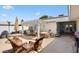 Comfortable outdoor patio featuring wicker furniture, a lattice-covered pergola, and a barbeque grill at 12826 W Maplewood Dr, Sun City West, AZ 85375