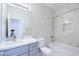 Bathroom featuring single sink vanity, mirror, toilet and tiled shower/tub combo at 12938 W Tara Ln, Surprise, AZ 85374