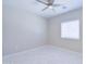 Bedroom features a modern fan, tile floors, neutral walls, and a window with blinds at 12938 W Tara Ln, Surprise, AZ 85374