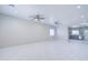 Bright living room features recessed lighting, tile floors, and an open concept design at 12938 W Tara Ln, Surprise, AZ 85374