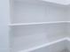 Walk-in pantry with custom shelving and ample storage space at 12938 W Tara Ln, Surprise, AZ 85374
