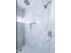 Modern tiled shower featuring marble-style walls and a rain shower head at 12938 W Tara Ln, Surprise, AZ 85374