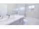Bathroom featuring marble tile, modern vanity, bathtub, and recessed lighting at 12940 W Tara Ln, Surprise, AZ 85374