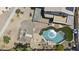 Aerial view showcasing a backyard oasis with a pool, pergola, and lush landscaping at 13160 W Windsor Ave, Goodyear, AZ 85395