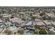 Aerial view of a home with a pool, nestled within a vibrant community with lush landscaping and tree-lined streets at 13160 W Windsor Ave, Goodyear, AZ 85395