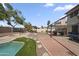 Serene backyard featuring a sparkling pool, pergola, and well-manicured landscaping for relaxation and enjoyment at 13160 W Windsor Ave, Goodyear, AZ 85395