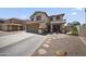 Charming two-story home with a well-maintained front yard, a two car garage, and inviting curb appeal at 13160 W Windsor Ave, Goodyear, AZ 85395