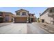 Charming two-story home featuring a two-car garage, covered porch, and desert landscaping at 13160 W Windsor Ave, Goodyear, AZ 85395