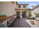 Inviting front porch with comfortable seating and decorative touches, offering a welcoming entry to the home at 13160 W Windsor Ave, Goodyear, AZ 85395