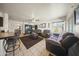 Spacious living room with tile floors, comfortable seating, and ample natural light at 13160 W Windsor Ave, Goodyear, AZ 85395