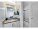 This bathroom has white cabinets, granite counters, and a framed mirror, with an attached shower at 13237 W Redstone Dr, Peoria, AZ 85383