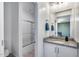The bathroom has granite counters, white cabinets, and adjoins a shower at 13237 W Redstone Dr, Peoria, AZ 85383