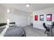 Bright bedroom with neutral tones, complemented by stylish sports decor and a functional workspace at 13237 W Redstone Dr, Peoria, AZ 85383