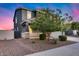 Charming two-story home featuring a landscaped front yard and an attached two-car garage at 13237 W Redstone Dr, Peoria, AZ 85383