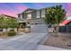 Attractive two-story home with landscaped front yard, stone accents, and a two-car garage at 13237 W Redstone Dr, Peoria, AZ 85383