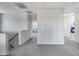Hallway features neutral walls and carpet, connecting living spaces with ease at 13237 W Redstone Dr, Peoria, AZ 85383