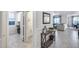 Hallway with an open view of the living and dining room, including a conveniently located powder room at 13237 W Redstone Dr, Peoria, AZ 85383