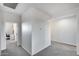 Bright hallway offers access to a private office, enhancing a functional and welcoming home at 13237 W Redstone Dr, Peoria, AZ 85383