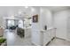 Hallway view into open-concept living space, showcasing bright kitchen and dining area with tile flooring at 13237 W Redstone Dr, Peoria, AZ 85383