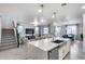 Open-concept kitchen island with sink and dishwasher connects the living and dining spaces seamlessly at 13237 W Redstone Dr, Peoria, AZ 85383