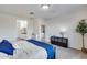 Bright main bedroom featuring ensuite bath, grey carpet, and white trim throughout at 13237 W Redstone Dr, Peoria, AZ 85383