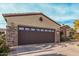 Spacious two car garage with beautiful stone accents and desert landscaping at 15452 W Skyview Way, Surprise, AZ 85374