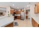 Charming kitchen with stainless appliances, wood cabinets, plenty of counter space, and an open layout at 15452 W Skyview Way, Surprise, AZ 85374