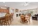 Bright and spacious living area with open layout to kitchen featuring breakfast bar and eat in dining area at 15452 W Skyview Way, Surprise, AZ 85374