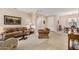 Open-concept living room with neutral colors and access to the dining room at 15452 W Skyview Way, Surprise, AZ 85374