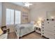 Bedroom with large window, ceiling fan, and comfortable decor at 15634 S 31St St, Phoenix, AZ 85048