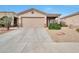 Well-maintained single-story home featuring desert landscaping, a large driveway, and an attached two-car garage at 15634 S 31St St, Phoenix, AZ 85048