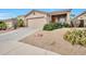 Charming single-story home with desert landscaping, a spacious driveway, and a welcoming front entrance at 15634 S 31St St, Phoenix, AZ 85048