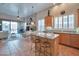 Open kitchen overlooking the living room with an island, granite countertops, and stainless steel appliances at 15634 S 31St St, Phoenix, AZ 85048