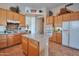 Bright kitchen with granite island, tile flooring, stainless appliances, and ample cabinet space at 15634 S 31St St, Phoenix, AZ 85048
