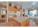 Spacious kitchen with a large island, tile floors, stainless appliances, and an open layout for entertaining at 15634 S 31St St, Phoenix, AZ 85048