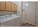 Functional laundry room with ample cabinet space and modern appliances at 15634 S 31St St, Phoenix, AZ 85048