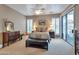 Spacious main bedroom with a ceiling fan, shuttered windows, and access to the patio at 15634 S 31St St, Phoenix, AZ 85048