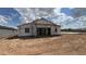 Backyard view of a home under construction with scaffolding at 15794 W Cheryl Dr, Waddell, AZ 85355