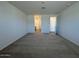 Large bedroom with carpet flooring with an ensuite bathroom at 15794 W Cheryl Dr, Waddell, AZ 85355