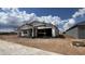 New construction home with scaffolding, hinting at a modern design in a developing neighborhood at 15794 W Cheryl Dr, Waddell, AZ 85355