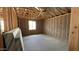 View of the garage showing insulation and a framed window at 15794 W Cheryl Dr, Waddell, AZ 85355