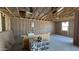 The garage under construction showcases insulation and a framed window at 15794 W Cheryl Dr, Waddell, AZ 85355
