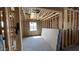 A framed room with a window shows insulation and drywall at 15794 W Cheryl Dr, Waddell, AZ 85355