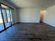 Spacious living area with sliding glass doors leading to a covered patio at 15794 W Cheryl Dr, Waddell, AZ 85355