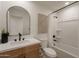 Contemporary bathroom featuring a wood vanity, sleek fixtures, and a shower-tub combination at 1609 W Yukon Dr, Phoenix, AZ 85027